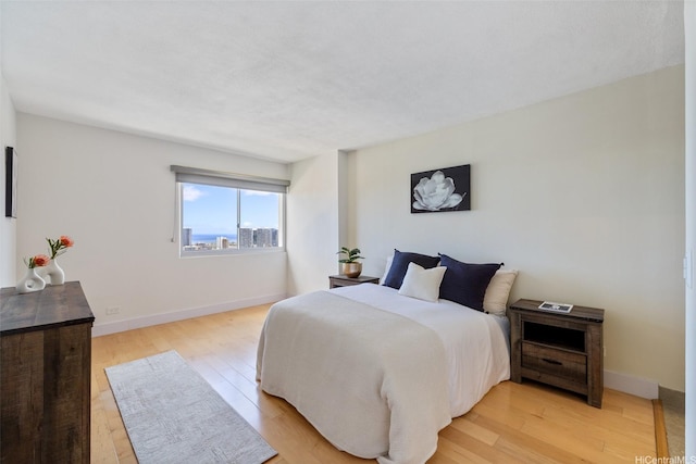 999 Wilder Ave Unit 1603, Honolulu, HI 96822 - bedroom with light wood-type flooring and baseboards