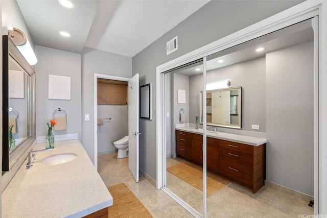 999 Wilder Ave Unit 1603, Honolulu, HI 96822 - full bathroom with vanity, toilet, and recessed lighting