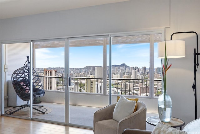 999 Wilder Ave Unit 1603, Honolulu, HI 96822 - living area with a view of city and wood finished floors