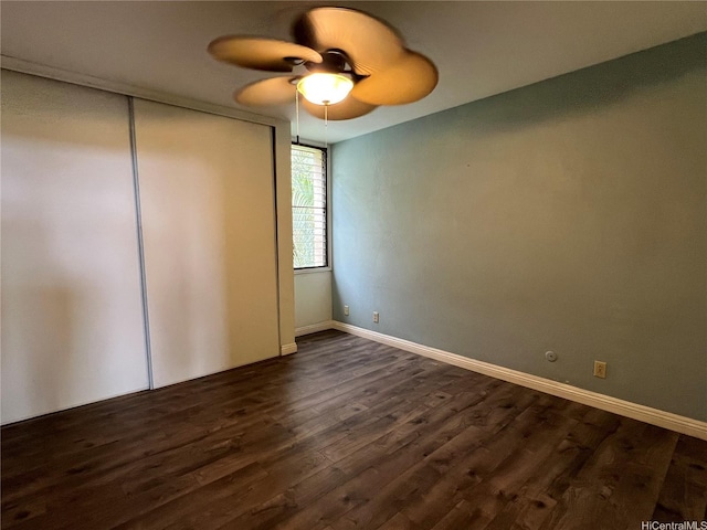 84-754 Ala Mahiku St Unit 1145C, Waianae, HI 96792 - unfurnished bedroom with dark wood-style floors, a closet, a ceiling fan, and baseboards