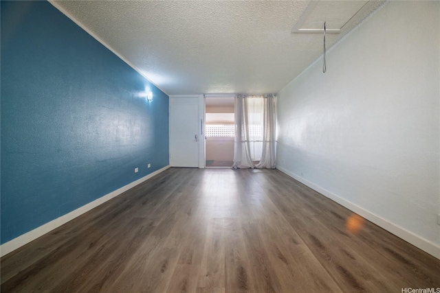 98-080 Uao Pl Unit C9, Aiea, HI 96701 - empty room featuring a textured ceiling, wood finished floors, and baseboards