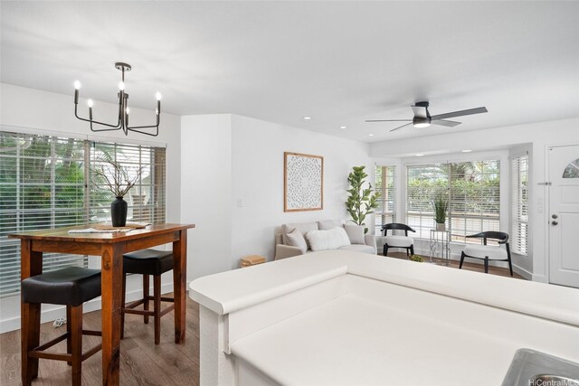 306 Mananai Pl Unit 4D, Honolulu, HI 96818 - bedroom featuring wood finished floors, a chandelier, and recessed lighting