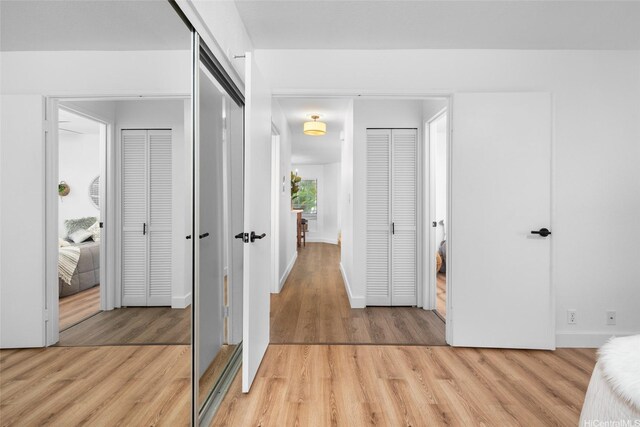 306 Mananai Pl Unit 4D, Honolulu, HI 96818 - hallway featuring light wood finished floors and baseboards