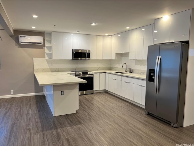 612 Ainapo St, Honolulu, HI 96825 - kitchen featuring stainless steel appliances, modern cabinets, a peninsula, a sink, and recessed lighting