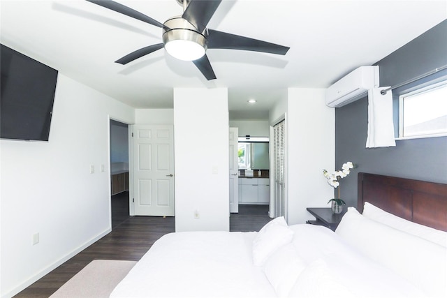 91-1031C Opuku St, Kapolei, HI 96707 - bedroom with a wall mounted air conditioner, dark wood-style floors, baseboards, ensuite bathroom, and ceiling fan