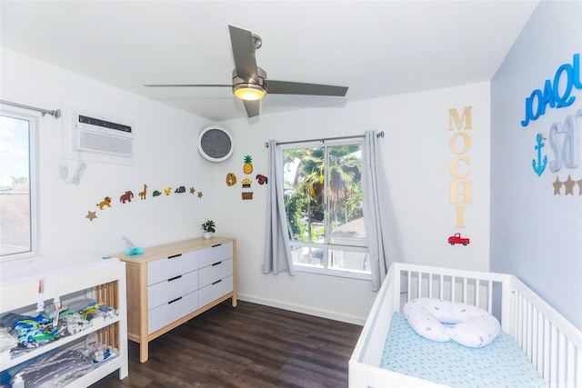 91-1031C Opuku St, Kapolei, HI 96707 - bedroom featuring a wall mounted AC, dark wood-style floors, baseboards, and a ceiling fan