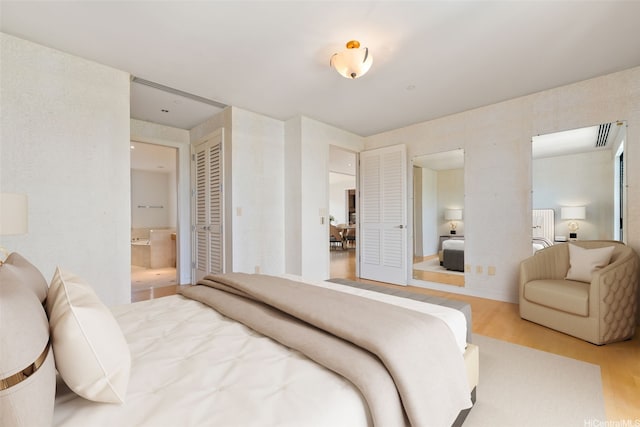 1740 S Beretania St Unit 10, Honolulu, HI 96826 - bedroom with wood finished floors and ensuite bathroom