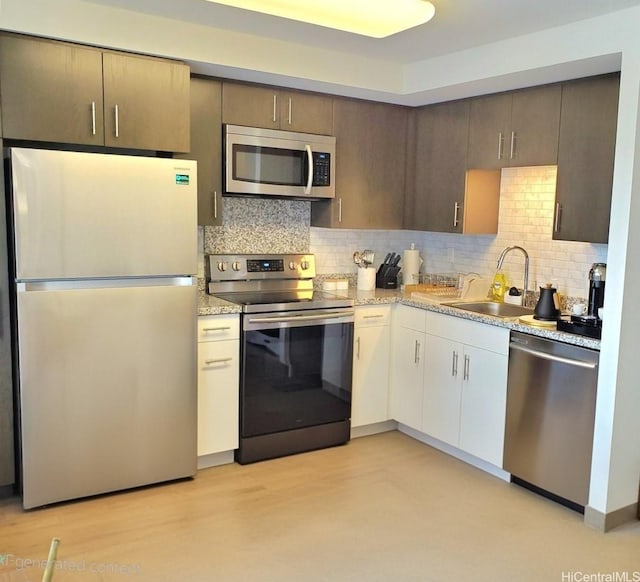988 Halekauwila St Unit 1801, Honolulu, HI 96814 - kitchen featuring stainless steel appliances, tasteful backsplash, dark brown cabinets, and white cabinets