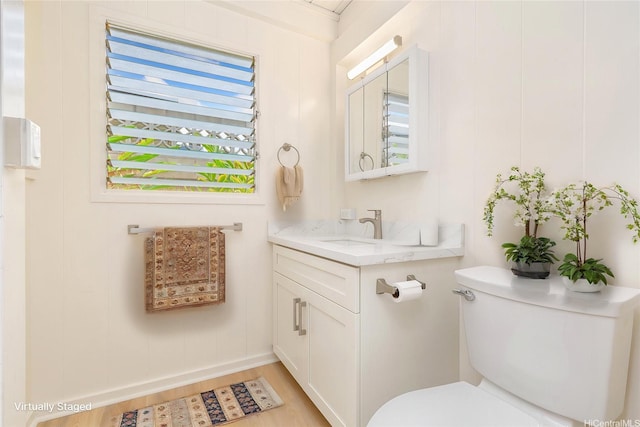 1645 Palamoi St, Pearl City, HI 96782 - half bath with vanity, wood finished floors, and toilet