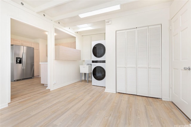 1645 Palamoi St, Pearl City, HI 96782 - laundry room featuring stacked washer and clothes dryer and light wood finished floors