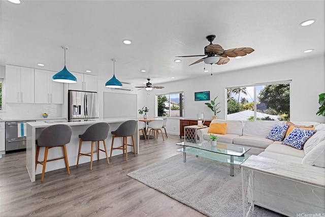 465A Kawailoa Rd, Kailua, HI 96734 - living area featuring recessed lighting, light wood-style floors, a ceiling fan, and baseboards