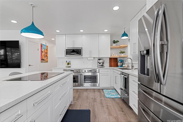 465A Kawailoa Rd, Kailua, HI 96734 - kitchen with appliances with stainless steel finishes, a sink, white cabinetry, pendant lighting, and recessed lighting