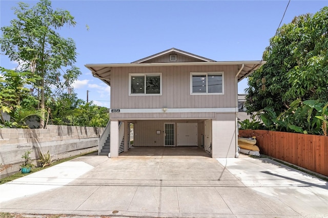 465A Kawailoa Rd, Kailua, HI 96734 - view of front of home featuring concrete driveway, a carport, and stairway