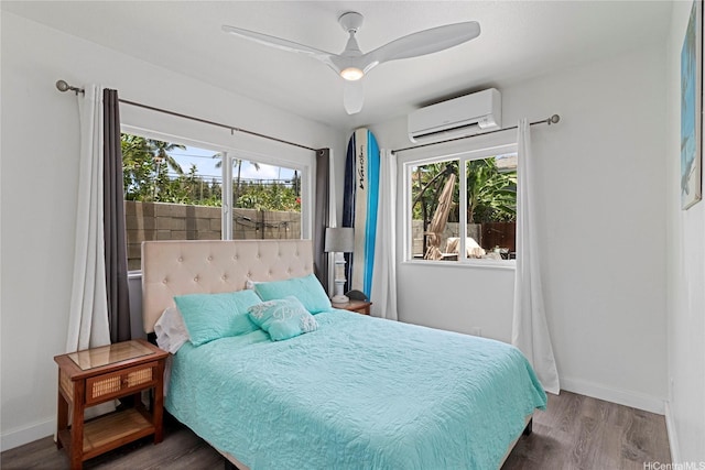 465A Kawailoa Rd, Kailua, HI 96734 - bedroom with an AC wall unit, multiple windows, wood finished floors, and baseboards