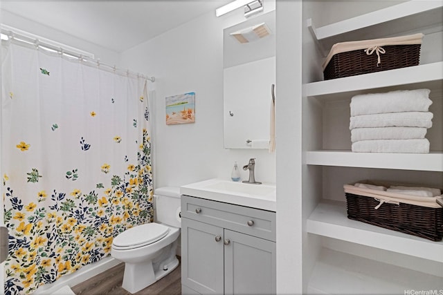 465A Kawailoa Rd, Kailua, HI 96734 - bathroom with toilet, vanity, wood finished floors, and a shower with curtain