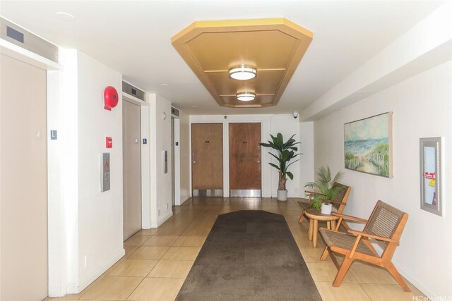 1060 Kamehameha Hwy Unit 2303A, Pearl City, HI 96782 - corridor featuring light tile patterned floors, elevator, and baseboards