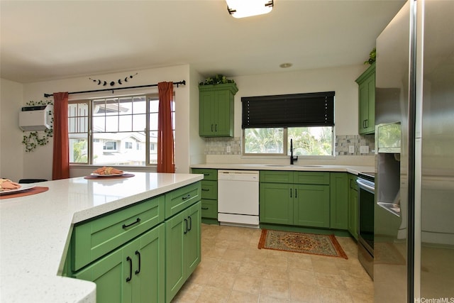 91-1175 Kaiau Ave Unit 903, Kapolei, HI 96707 - kitchen featuring green cabinetry, stainless steel appliances, a sink, and tasteful backsplash