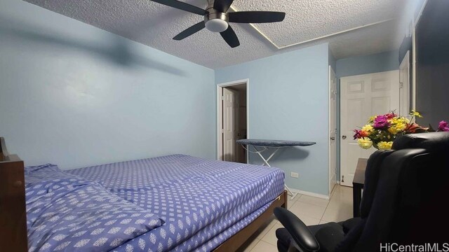 3161 Ala Ilima St Unit 2112, Honolulu, HI 96818 - bedroom featuring a textured ceiling, tile patterned flooring, and ceiling fan