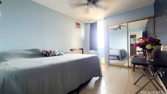 3161 Ala Ilima St Unit 2112, Honolulu, HI 96818 - bedroom featuring light tile patterned flooring and ceiling fan