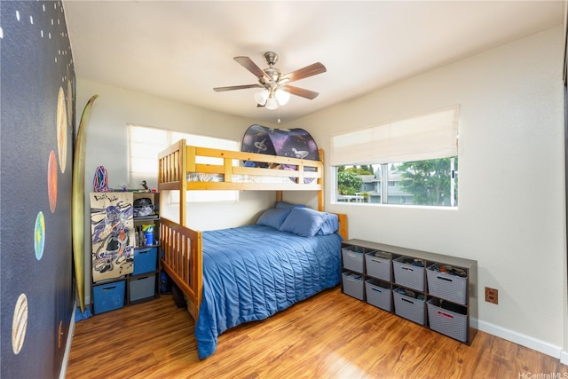 94-816 Lumiauau St Unit Kk102, Waipahu, HI 96797 - bedroom featuring wood finished floors and a ceiling fan