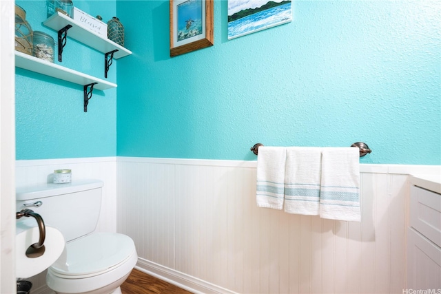 94-816 Lumiauau St Unit Kk102, Waipahu, HI 96797 - half bath with a wainscoted wall, toilet, and wood finished floors