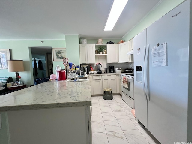 1133 Waimanu St Unit 911, Honolulu, HI 96814 - kitchen featuring white appliances, a sink, ornamental molding, open shelves, and a peninsula