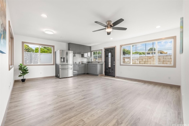 1528 Hooli Cir, Pearl City, HI 96782 - unfurnished living room featuring ceiling fan, light wood-type flooring, baseboards, recessed lighting, and a sink