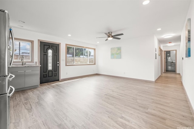 1528 Hooli Cir, Pearl City, HI 96782 - unfurnished living room featuring light wood-style floors, ceiling fan, recessed lighting, and baseboards