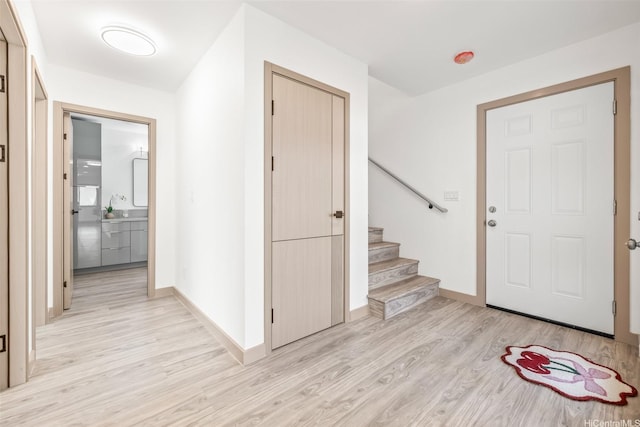 1528 Hooli Cir, Pearl City, HI 96782 - entrance foyer featuring light wood-style floors, baseboards, and stairway