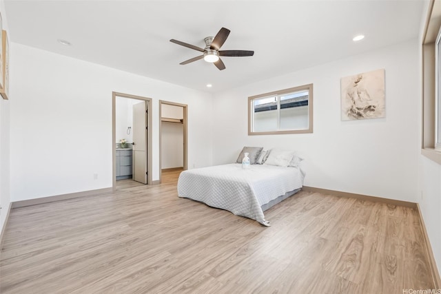 1528 Hooli Cir, Pearl City, HI 96782 - bedroom with light wood finished floors, baseboards, ceiling fan, a spacious closet, and recessed lighting