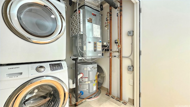 1001 Queen St Unit 2605, Honolulu, HI 96814 - washroom with stacked washing machine and dryer, water heater, and heating unit