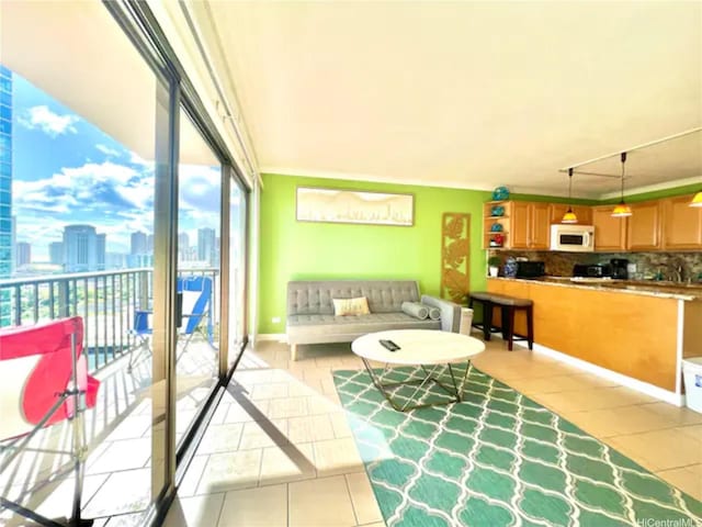 2140 Kuhio Ave Unit 1808, Honolulu, HI 96815 - living area featuring light tile patterned floors and a view of city