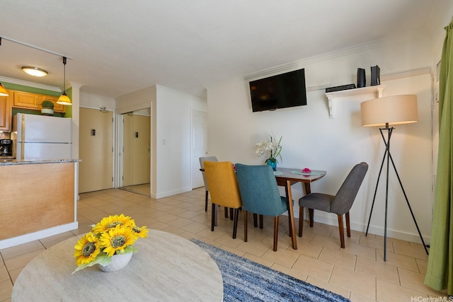 2140 Kuhio Ave Unit 1808, Honolulu, HI 96815 - dining space with light tile patterned flooring, ornamental molding, and baseboards