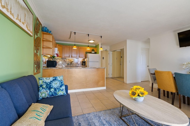 2140 Kuhio Ave Unit 1808, Honolulu, HI 96815 - living area featuring light tile patterned floors, track lighting, and crown molding