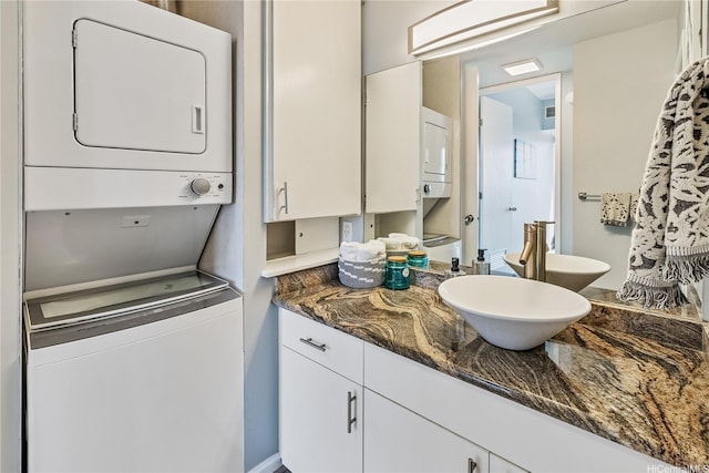 411 Hobron Ln Unit 3905, Honolulu, HI 96815 - bathroom featuring stacked washer / dryer and vanity