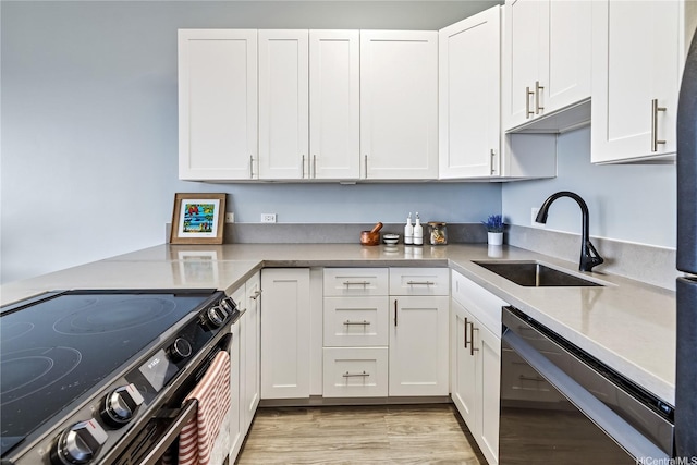 411 Hobron Ln Unit 3905, Honolulu, HI 96815 - kitchen with electric range, stainless steel dishwasher, a sink, and white cabinets
