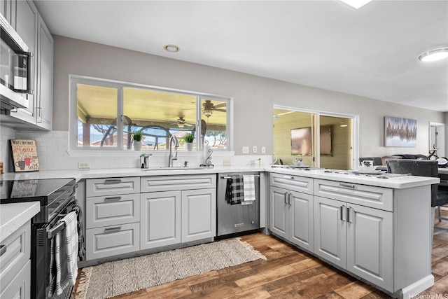 91-1032 Kamaehu St, Ewa Beach, HI 96706 - kitchen with a sink, appliances with stainless steel finishes, gray cabinetry, and light countertops