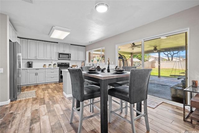 91-1032 Kamaehu St, Ewa Beach, HI 96706 - dining area with light wood-style floors and ceiling fan