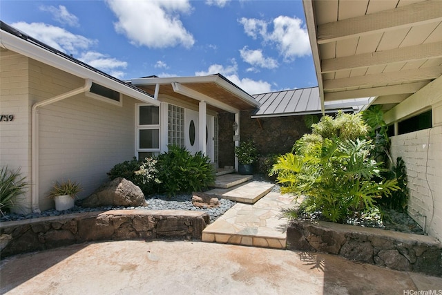 759 Elepaio St, Honolulu, HI 96816 - doorway to property featuring a standing seam roof, metal roof, and stone siding