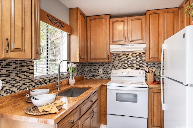 91-1167 Kamaaha Loop Unit 19F, Kapolei, HI 96707 - kitchen with white appliances, under cabinet range hood, a sink, butcher block countertops, and decorative backsplash