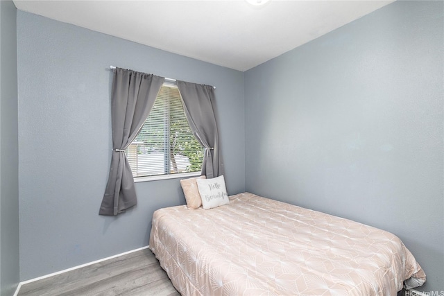 91-1167 Kamaaha Loop Unit 19F, Kapolei, HI 96707 - bedroom with wood finished floors and baseboards