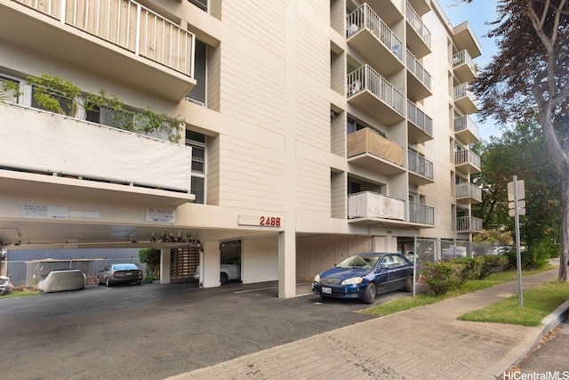 2488 Kapiolani Blvd Unit 203, Honolulu, HI 96826 - view of apartment building / complex featuring covered parking