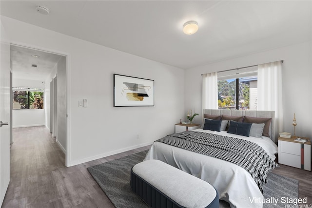 95-1039 Palamoa St Unit 107, Mililani, HI 96789 - bedroom featuring wood finished floors and baseboards