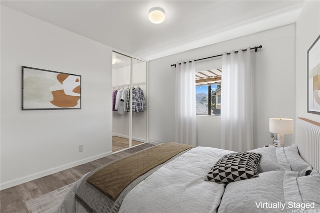 95-1039 Palamoa St Unit 107, Mililani, HI 96789 - bedroom featuring wood finished floors, a closet, and baseboards