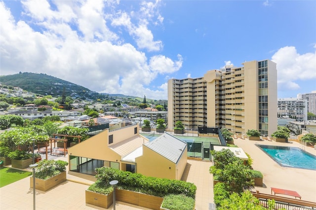 1717 Mott Smith Dr Unit 707, Honolulu, HI 96822 - view of building exterior with a community pool and a mountain view