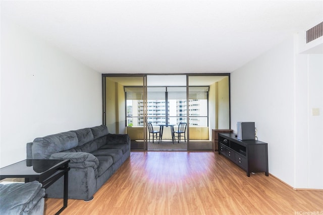 1717 Mott Smith Dr Unit 707, Honolulu, HI 96822 - living area featuring wood finished floors