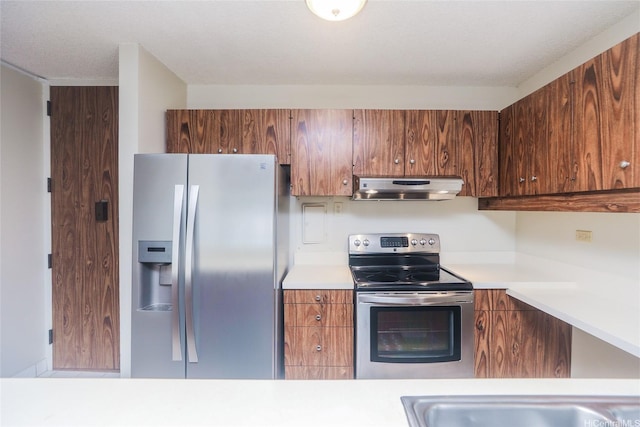 1717 Mott Smith Dr Unit 707, Honolulu, HI 96822 - kitchen with appliances with stainless steel finishes, light countertops, extractor fan, and brown cabinets