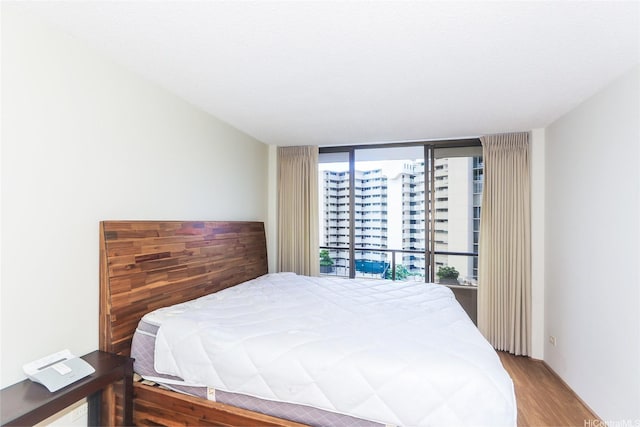 1717 Mott Smith Dr Unit 707, Honolulu, HI 96822 - bedroom with wood finished floors