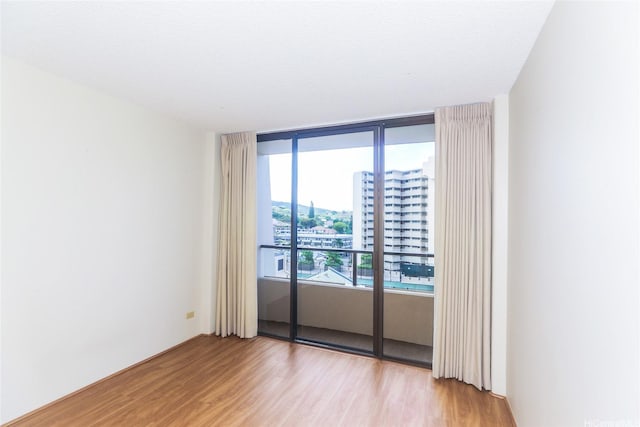 1717 Mott Smith Dr Unit 707, Honolulu, HI 96822 - unfurnished room with light wood finished floors and a city view