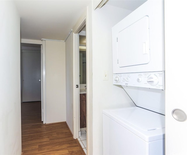 1717 Mott Smith Dr Unit 707, Honolulu, HI 96822 - washroom featuring estacked washer and dryer and wood finished floors